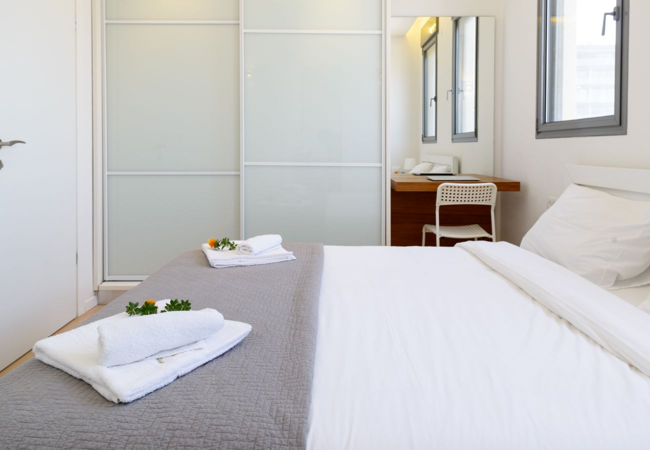 Bright and beautiful bedroom in Tel Aviv apartment  Bright bedroom with big and comfy bed and working space on Ben Yehuda st.